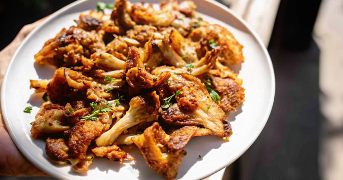 Caramelized lion's mane mushroom recipe Served on a Rustic Plate