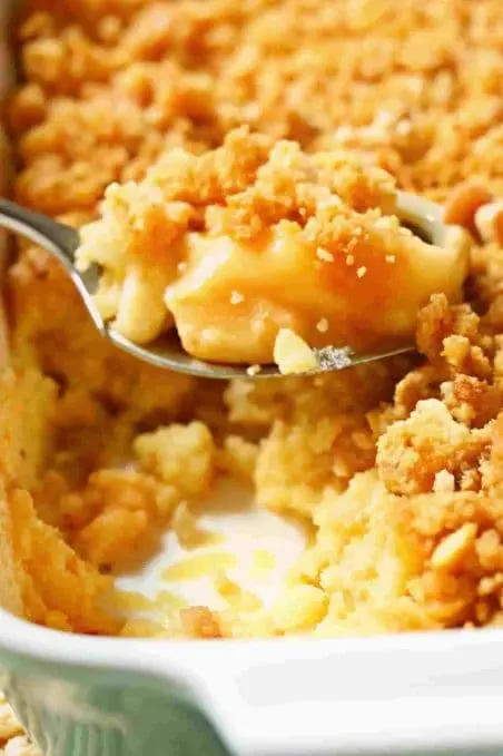 Family enjoying pineapple casserole together at the dining table.