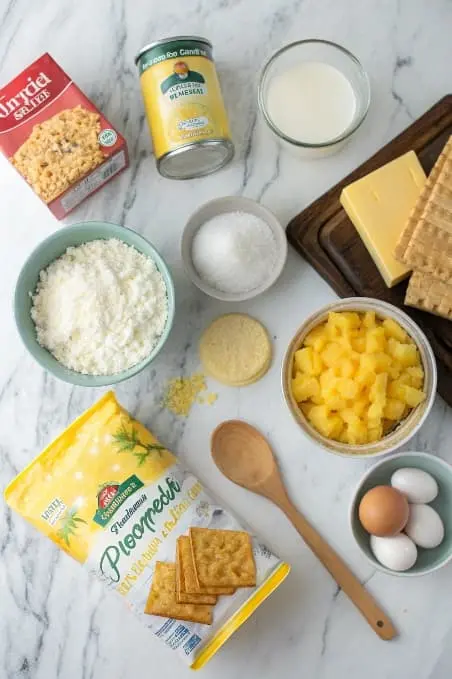 Ingredients for pineapple casserole arranged neatly on a countertop.